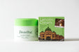 two products: a jar of Pearlbe Lanolin Cream and a box of Lanolin Cream with a picture of a building.