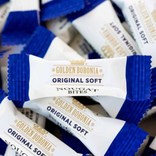 a close-up view of several packages of Golden Boronia Original Soft Nougat bites.