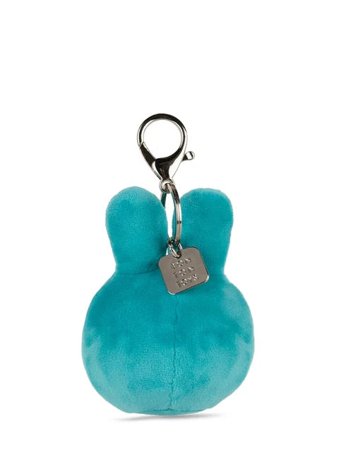 A teal-colored plush keychain with a metal clasp and a small tag attached to it.