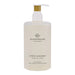A bottle of hand wash with a pump dispenser, labeled as "KOTO IN BLOOM CAMELLIA & LOSUS".