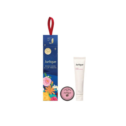a blue box with a red ribbon, a white tube, and a pink circular object, all of which appear to be related to beauty or skincare products.