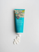 A tube of Blue Gum Eucalyptus Hand & Body Butter with organic shea butter and macadamilla oil, with a bird illustration on the label.
