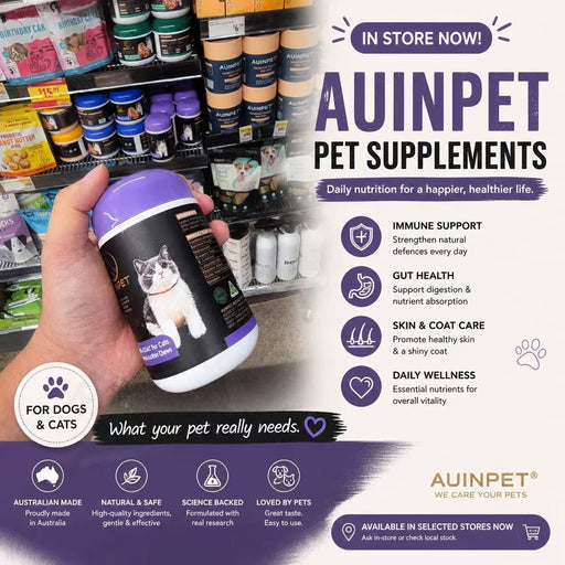 The image is an advertisement for pet supplements, specifically focusing on a purple pill labeled "Auinpet" for dogs. The ad highlights the benefits of the product, such as immune support, gut health, and skin and coat care, and emphasizes that it is available in selected stores. The ad also mentions that the product is Australian-made and backed by science, and is loved by pets.