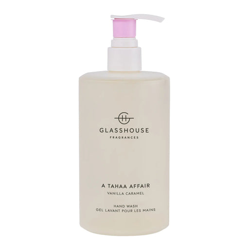 A bottle of GLASSHOUSE Fragrances hand wash with a pink pump dispenser.