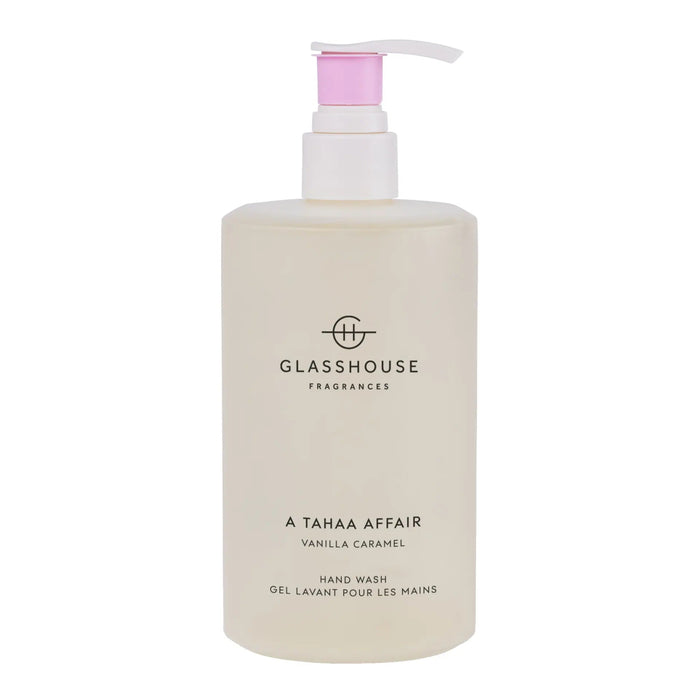 A bottle of GLASSHOUSE Fragrances hand wash with a pink pump dispenser.