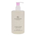 A bottle of GLASSHOUSE Fragrances hand wash with a pink pump dispenser.