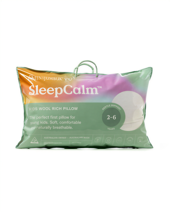 a pillow with a label that describes it as a "Kids Wool Rich Pillow" designed for young children.