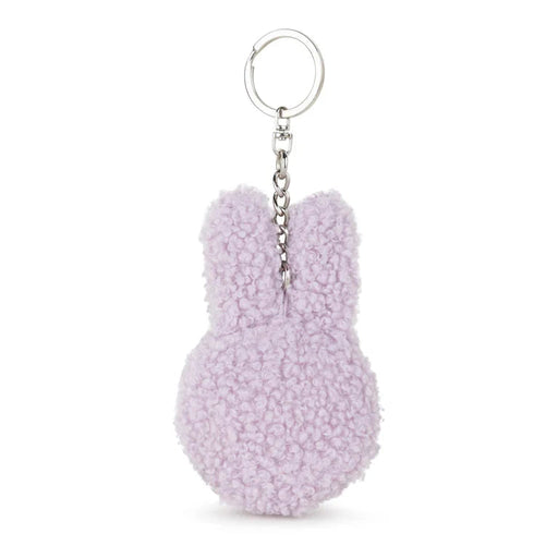 A keychain in the shape of a bunny with a fluffy, textured appearance.