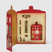 a red box with a lid and a red jar with a lid, both of which are decorated with illustrations of people and buildings.