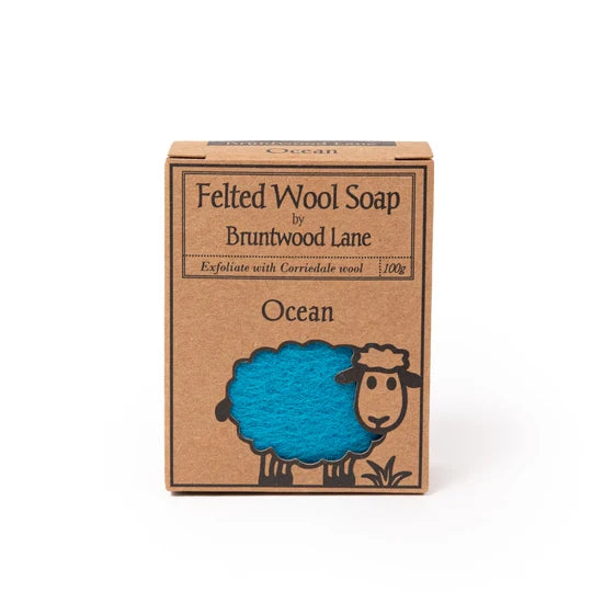 A cardboard box containing a blue felt soap product, labeled as "Feeted Wool Soap by Bruntwood Lane" and "Ocean".