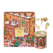 a gingerbread house-themed candle and a box with a gingerbread house illustration.