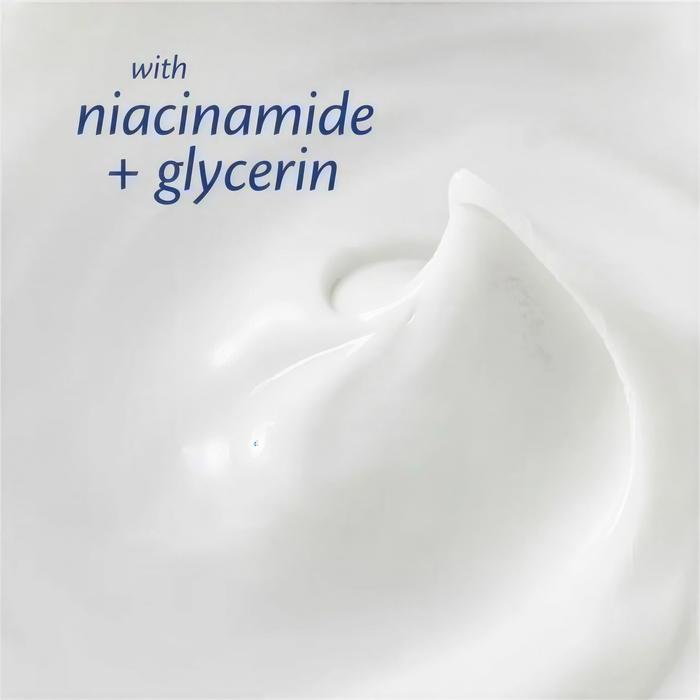 The image is a close-up of a white, creamy substance, possibly a lotion or cream, with a text overlay that reads "with niacinamide + glycerin".