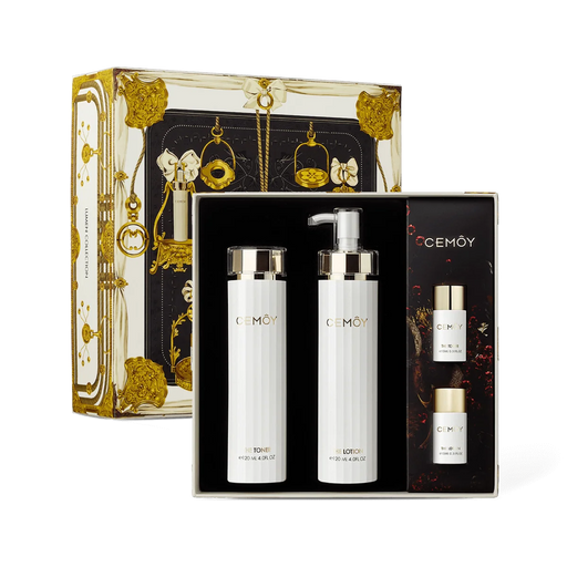 a set of three beauty products from the brand CEMOY, including a pump bottle, a pump bottle, and a spray bottle, all presented in a luxurious, gold-colored box.