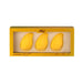 a set of three yellow mango-shaped makeup blenders arranged in a yellow box with a gold border.