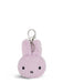 A small, plush keychain in a light purple color.