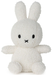 A white stuffed bunny toy with black eyes and a black mouth.