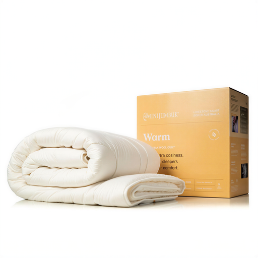 a white comforter and a cardboard box for the same product, likely a bedding item.