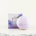 a soap bar and its packaging, both with a purple and white color scheme.