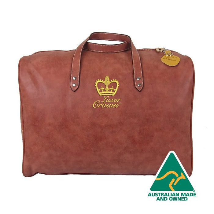 A brown leather duffel bag with a gold crown logo and the text "Luxor Crowni" printed on it.
