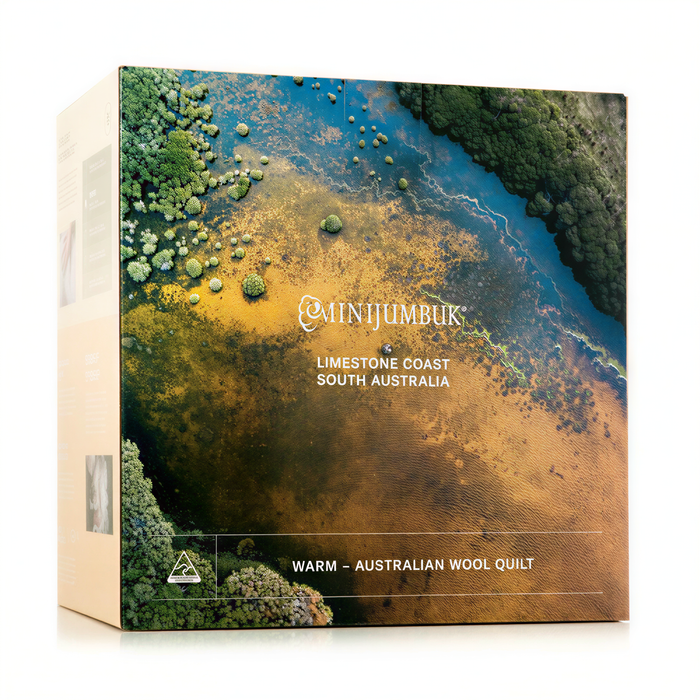 The image is a box for an Australian wool quilt, featuring an aerial view of a river and lush greenery.