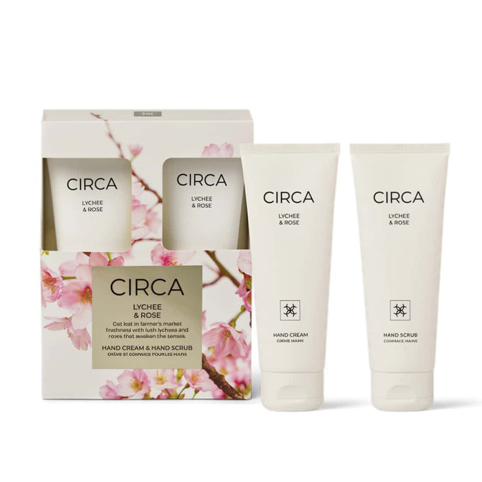 a set of three circular skincare products from the brand Circa, including a hand cream and a hand scrub. The products are presented in a white box with a floral design, and two of the products are placed next to each other.