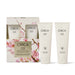 a set of three circular skincare products from the brand Circa, including a hand cream and a hand scrub. The products are presented in a white box with a floral design, and two of the products are placed next to each other.