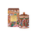 a gingerbread house-themed tin can and a box of tea from the Glasshouse brand.