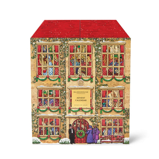 The image is a colorful and detailed illustration of a building with a red roof, featuring a large window with a stained glass design and a sign that reads "GLASSHOUSE ADVENT CALENDAR".