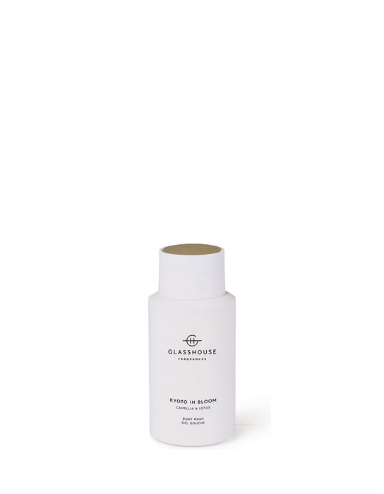 A bottle of KYOTO IN BLOOM, a fragrance oil, is shown against a white background.