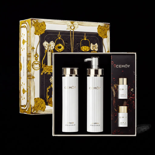 a set of three beauty products from the brand CEMOY, including a pump bottle, a pump bottle, and a spray bottle, all presented in a luxurious, gold-colored box.