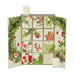An open advent calendar with a floral design and candles on top.