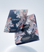 two blue boxes with a floral design, one on top of the other, against a white background.