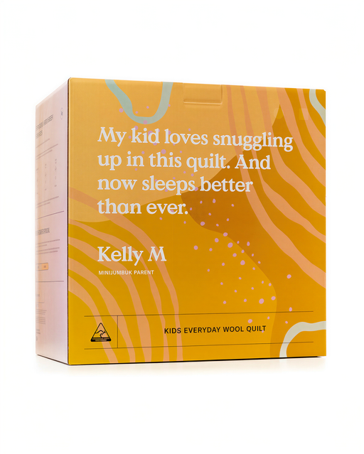The image is a box for a children's wool quilt, featuring a vibrant yellow and orange color scheme with a text description and a small logo.