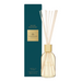 A glasshouse velvet rhapsody water lily fragrance diffuser, with a clear glass bottle containing white sticks and a dark green box with gold lettering.