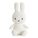 A white plush toy rabbit with black eyes and a black mouth.