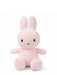 A pink stuffed bunny toy with large ears and a small black nose.