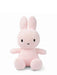 A pink stuffed bunny toy with large ears and a small black nose.