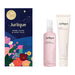 a set of beauty products, including a bottle of hand cream, a tube of hand cream, and a box of hand cream. The products are arranged next to each other, with the hand cream tube on the right side of the image and the hand cream box on the left side.