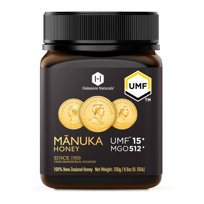 a bottle of Manuka Honey with a black cap and a label that includes text and images.