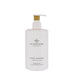 A white pump bottle with a gold pump cap, containing a hand lotion product labeled "KYOTO IN BLOOM CAMPELLULA & LOTUS".