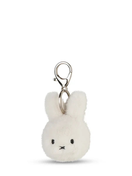 A white plush rabbit charm with a silver metal clasp attached to it.