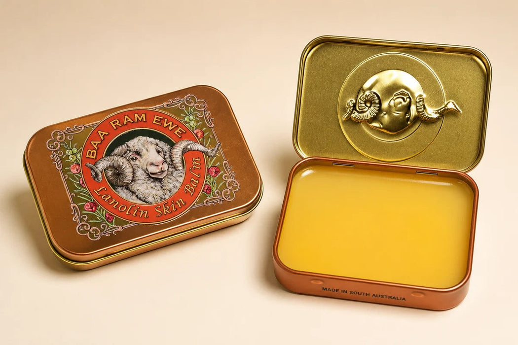 two tin cans, one with a lid and the other open, both containing a yellow substance.