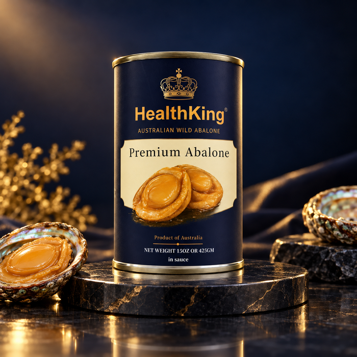 a can of HealthKing Premium Abalone product, which is a type of wild abalone. The can is placed on a marble surface, with a few abalone shells visible in the background.
