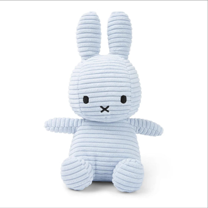 A light blue stuffed bunny toy with large ears and a black x on its face.