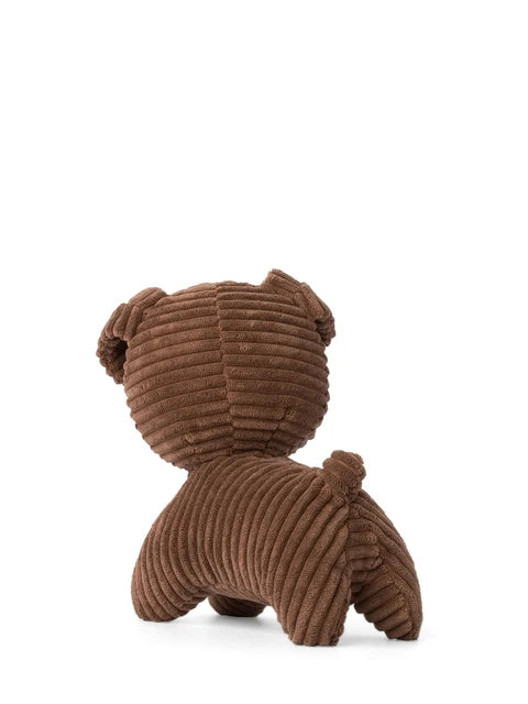 A brown, coiled stuffed animal dog toy is shown against a white background.