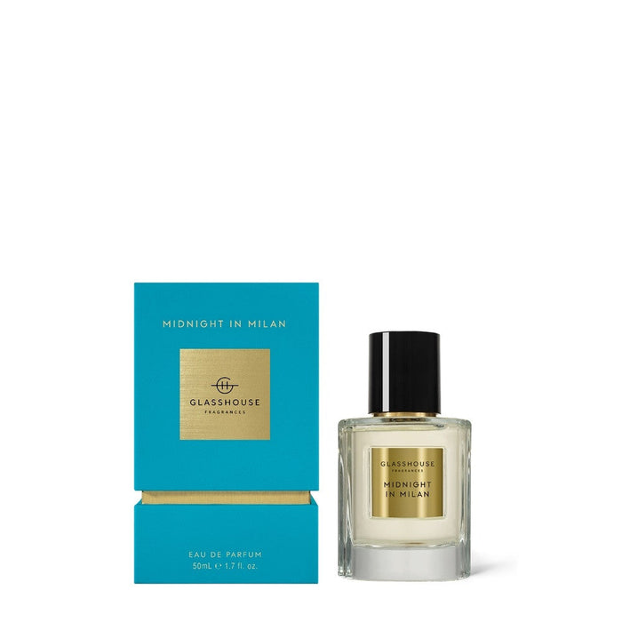 a bottle of Midnight in Milan eau de parfum by GLASHHOUSE Fragrances, placed next to its packaging box.