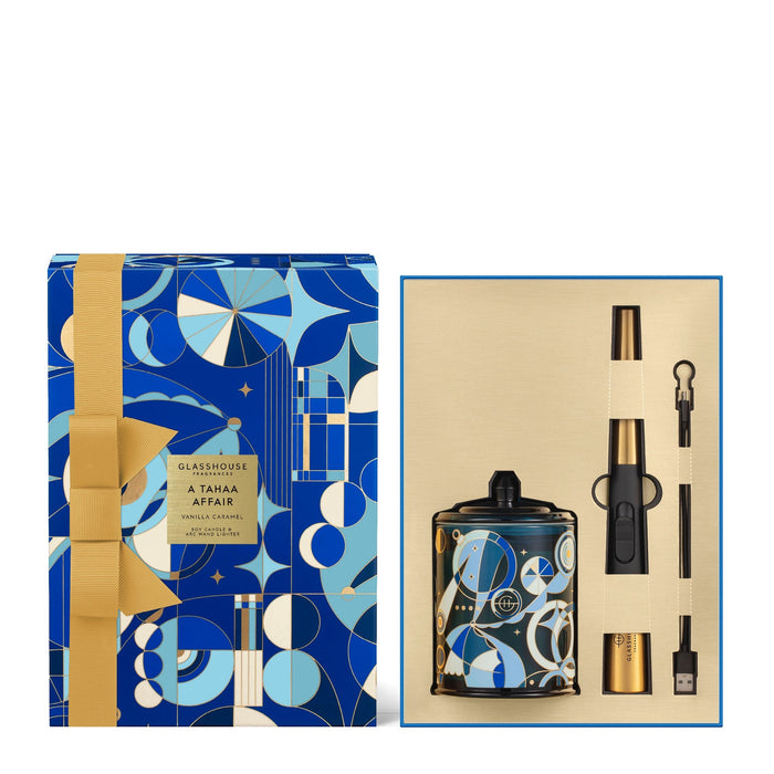 a set of products, including a blue and gold box with a gold ribbon, a black and gold bottle, and a black and gold lighter.
