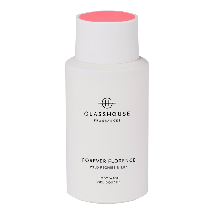 a bottle of Forever Florence body wash with a pink cap.