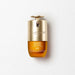 A bottle of double serum eye treatment by Clarins Paris, with a gold cap and a yellow liquid inside.