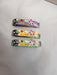 Three colorful nail clippers with cartoon faces and the word "miss" printed on them.